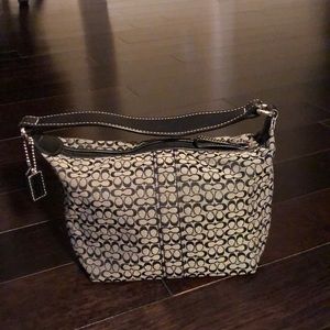 Coach shoulder bag.  Brand new, hasn’t been used.  Immaculate condition.